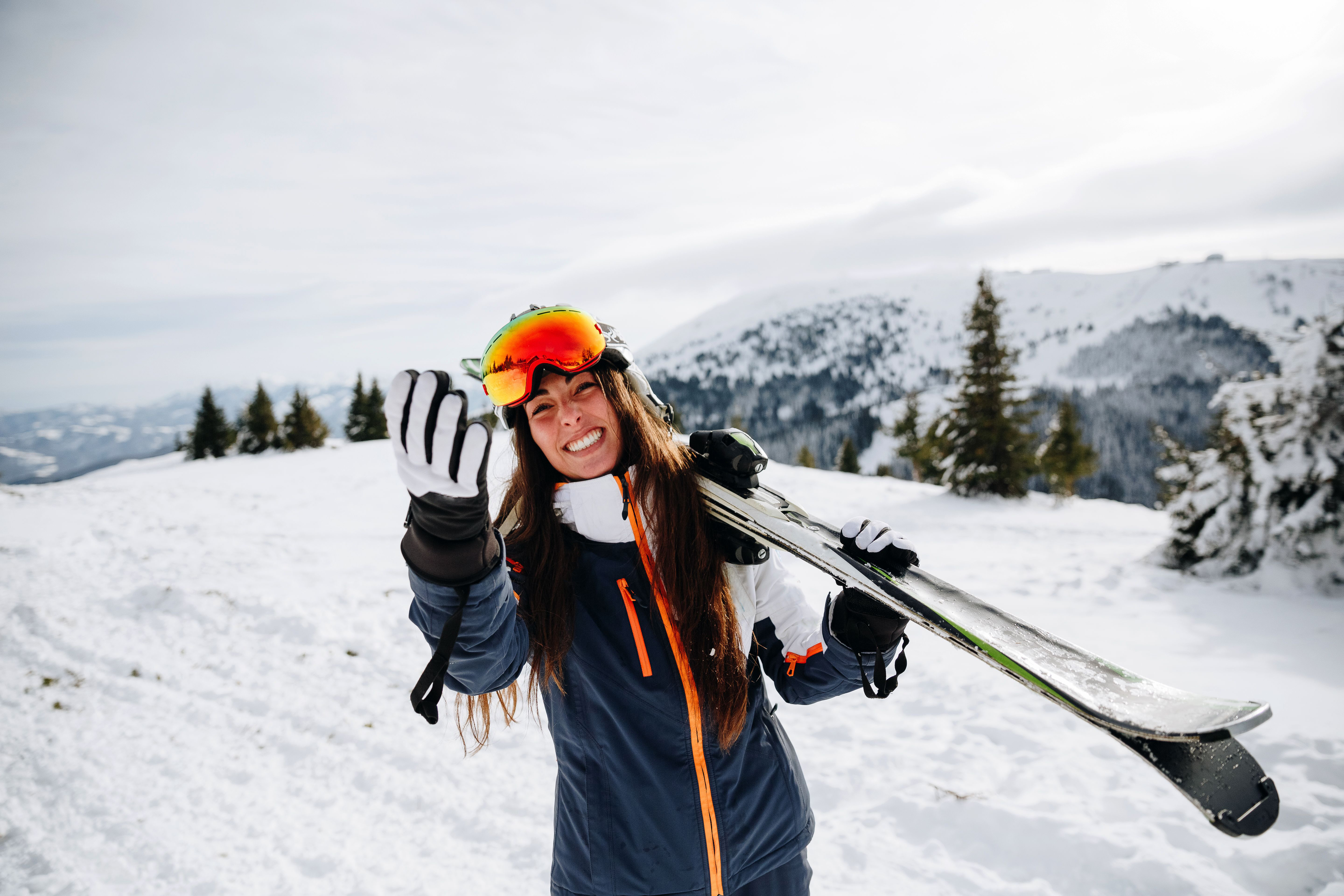 Women Smiling Holding Ski's